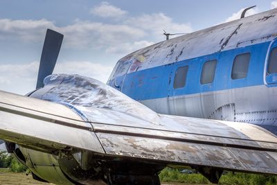 Old airplane against sky