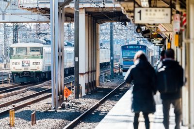 People on railroad station platform