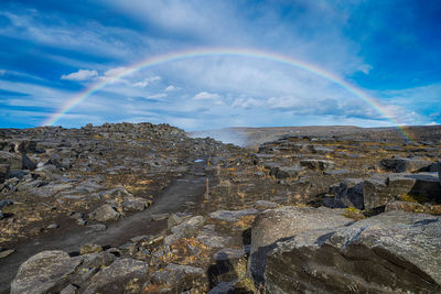 Rainbow over rocky landscape