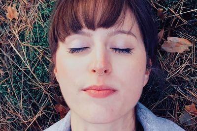 Close-up of young woman with eyes closed