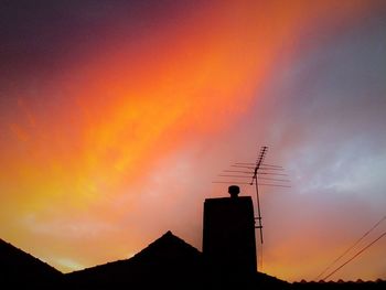 Silhouette of built structure at sunset