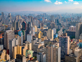 High angle view of buildings in city against sky