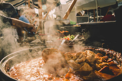 Steam in cooking pot at stall