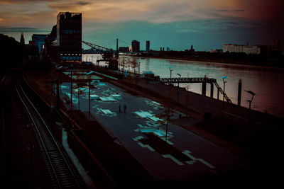 High angle view of railroad tracks against sky during sunset