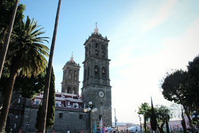 Low angle view of cathedral against sky on sunny day