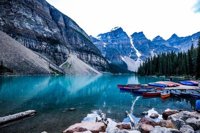 Scenic view of lake by mountains against clear sky