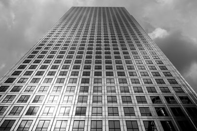 Low angle view of building against cloudy sky