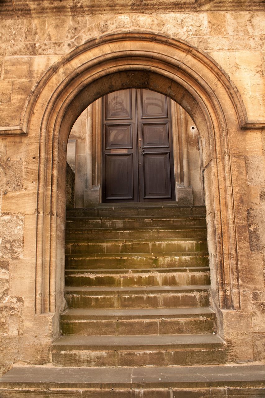 architecture, built structure, steps, building exterior, door, entrance, steps and staircases, arch, old, closed, staircase, window, house, low angle view, building, brick wall, day, doorway, no people, history