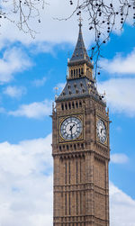 Low angle view of clock tower against sky