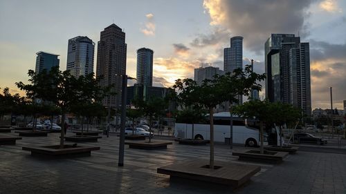 View of modern buildings against sky during sunset