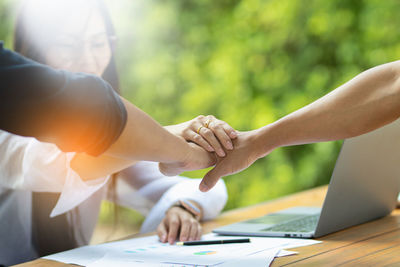 Cropped image of business colleagues working at office