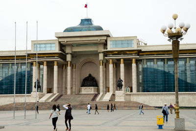 Group of people in front of building