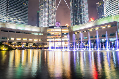 Illuminated buildings at waterfront