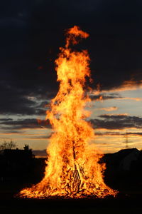 Bonfire against sky at sunset