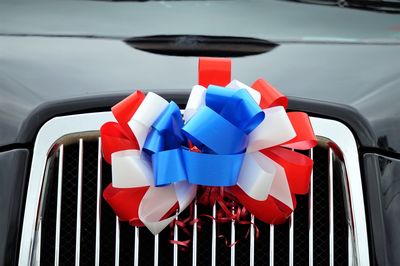 Close-up of ribbon on car grille