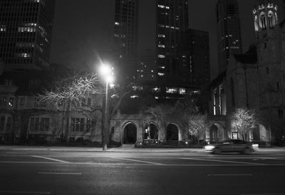 Illuminated buildings in city at night