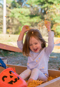 Portrait of smiling girl playing outdoors