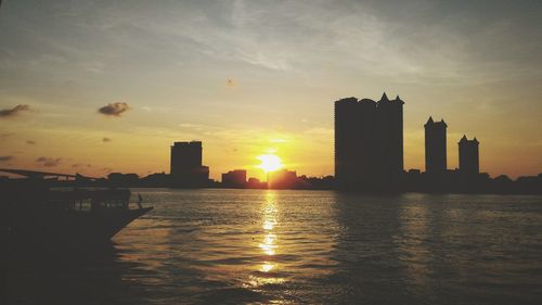 Scenic view of sunset over city