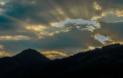 Low angle view of dramatic sky during sunset