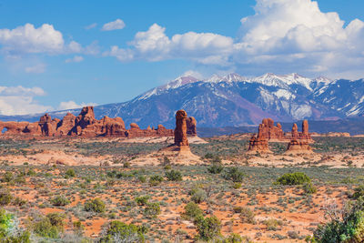 Scenic view of landscape against cloudy sky