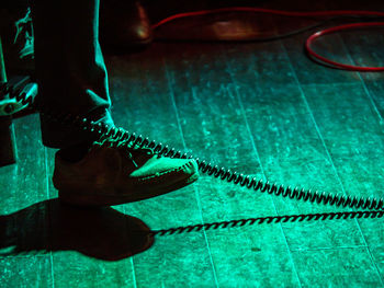 Low section of man wearing canvas shoes