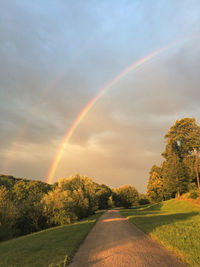 Scenic view of rainbow over field