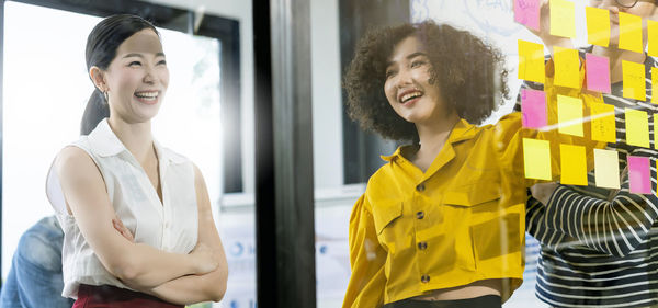 Portrait of smiling young woman in store