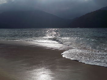 Scenic view of sea against sky at sunset