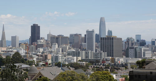 Modern buildings in city against sky