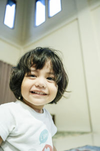Portrait of smiling boy at home
