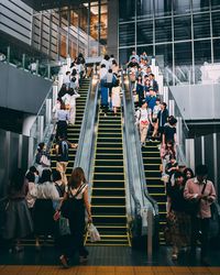 High angle view of people on staircase of building