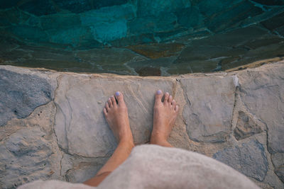 Low section of woman on rock