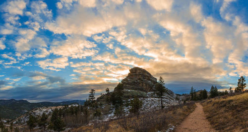 Scenic view of mountains against sky at sunset