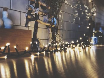 Close-up of illuminated electric lights on floor