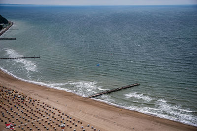 High angle view of sea shore against sky