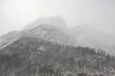 Scenic view of mountains in foggy weather