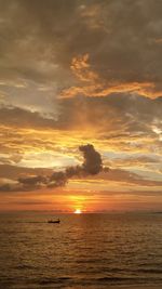 Scenic view of calm sea at sunset
