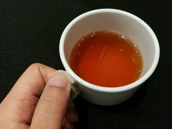 Close-up of hand holding tea