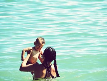 Full length of young woman in water