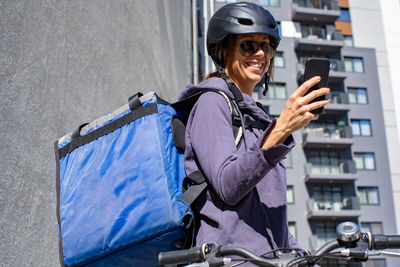 Female delivery person receiving order