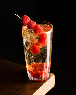 Close-up of drink in glass against black background