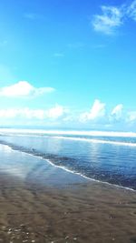 Scenic view of sea against blue sky