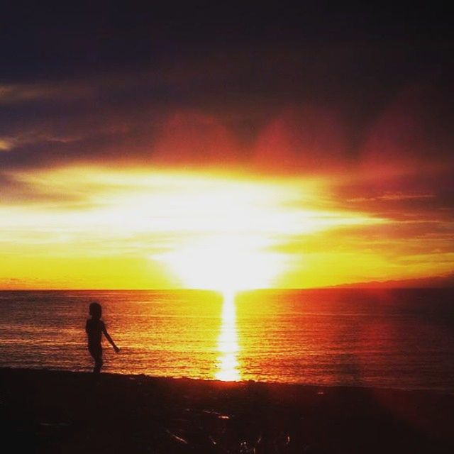 sunset, horizon over water, sea, silhouette, sky, water, sun, scenics, beauty in nature, beach, orange color, tranquil scene, cloud - sky, tranquility, lifestyles, leisure activity, idyllic, nature