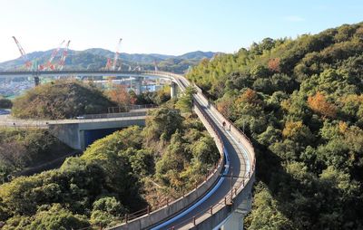 High angle view of bridge in city against sky