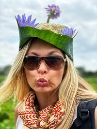 Close-up portrait of woman wearing sunglasses and headdress