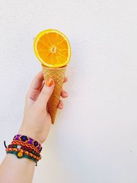 Midsection of woman holding ice cream