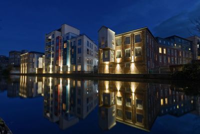 Reflection of illuminated buildings in water