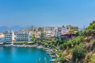 High angle view of cityscape against clear blue sky