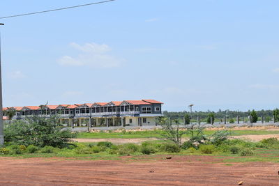 House on field against sky