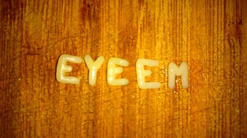 Close-up of illuminated text on wood